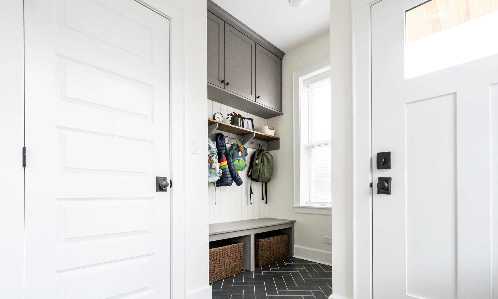 mudroom remodel with herringbone slate tile and built in cabinetry in la grange park