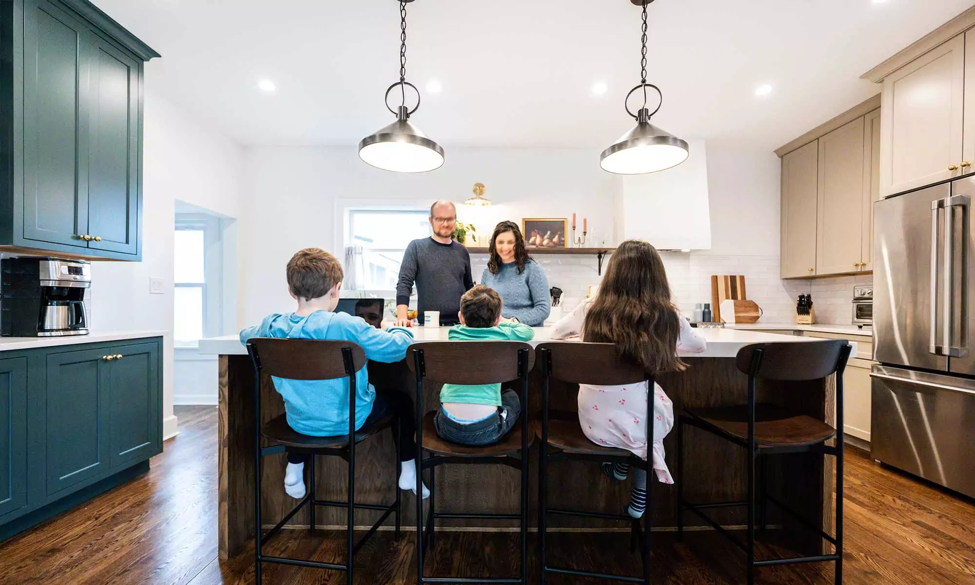 family gathered around a kitchen island in la grange park Illinois vintage kitchen remodel