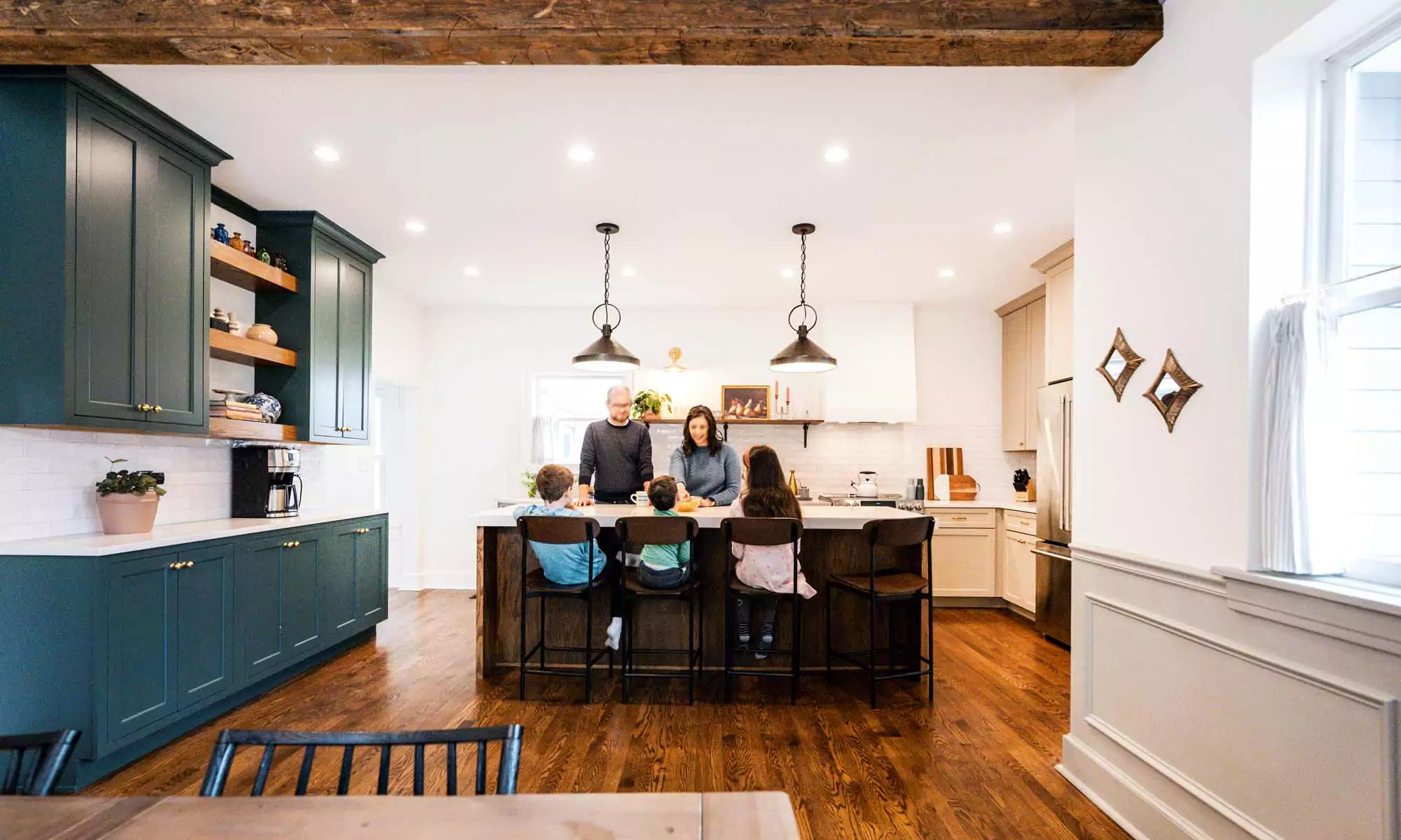 family gathered around a kitchen island in la grange park Illinois vintage kitchen remodel