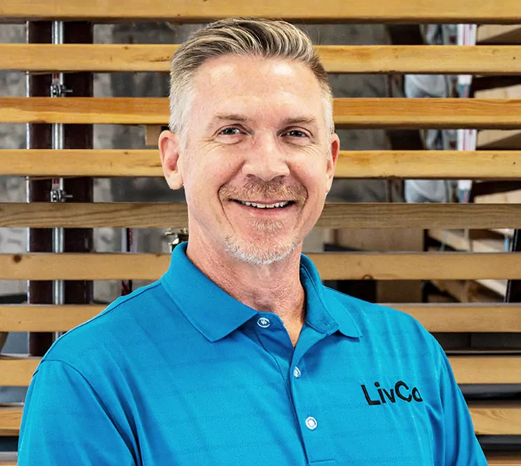 Project manager headshot wearing livco blue golf shirt