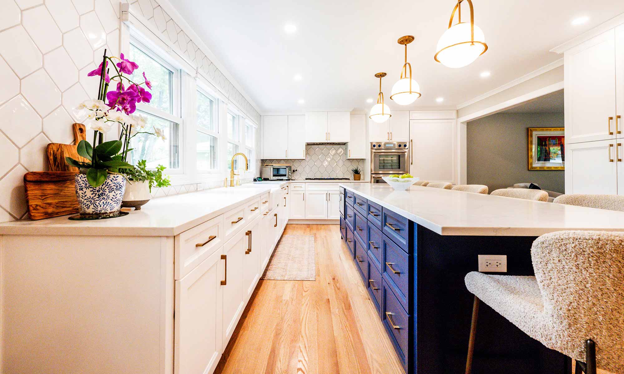 A kitchen with white cabinets and blue drawers