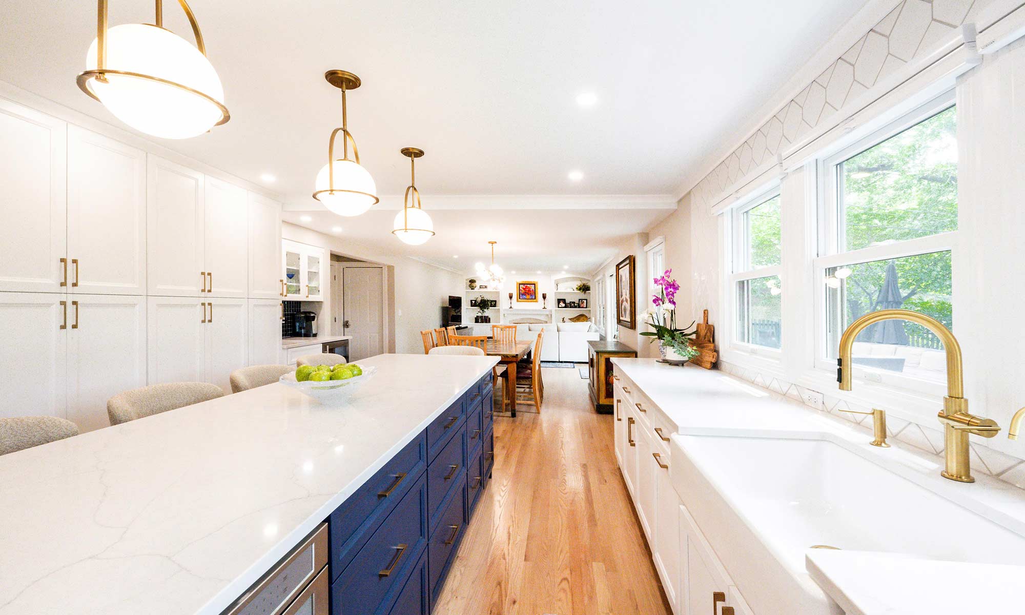 A kitchen with white cabinets and blue counter tops
