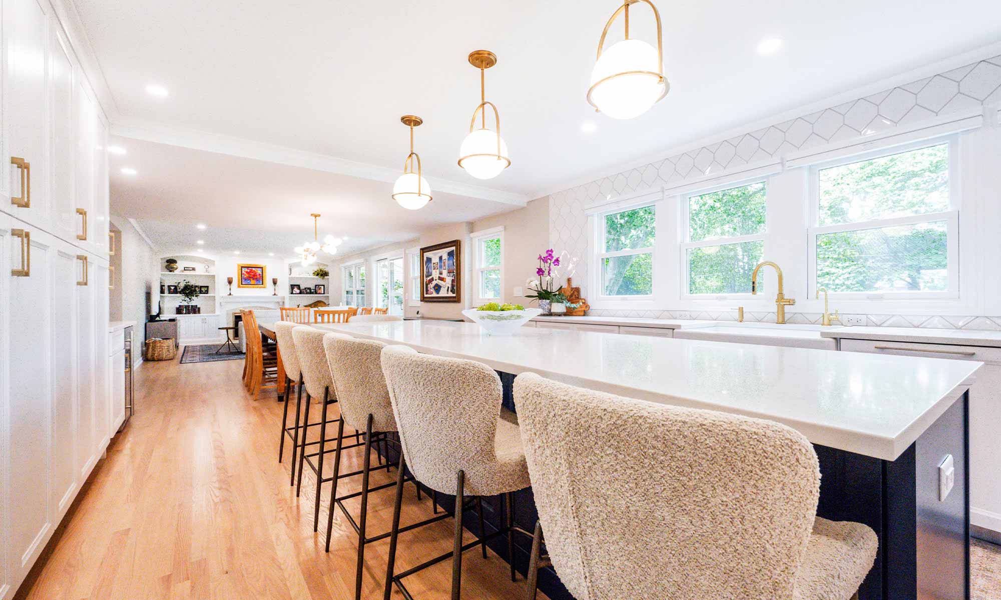 A kitchen with white cabinets and blue counter tops