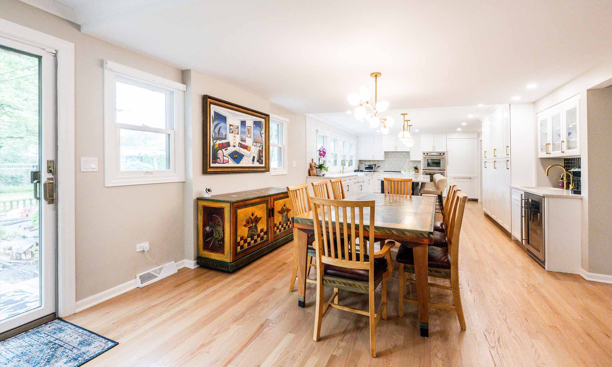 A dining room with a table and chairs