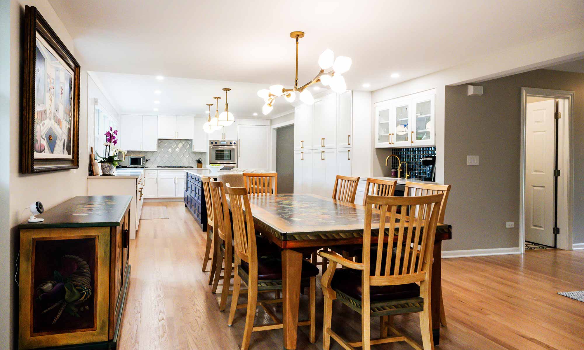 A dining room with a table and chairs
