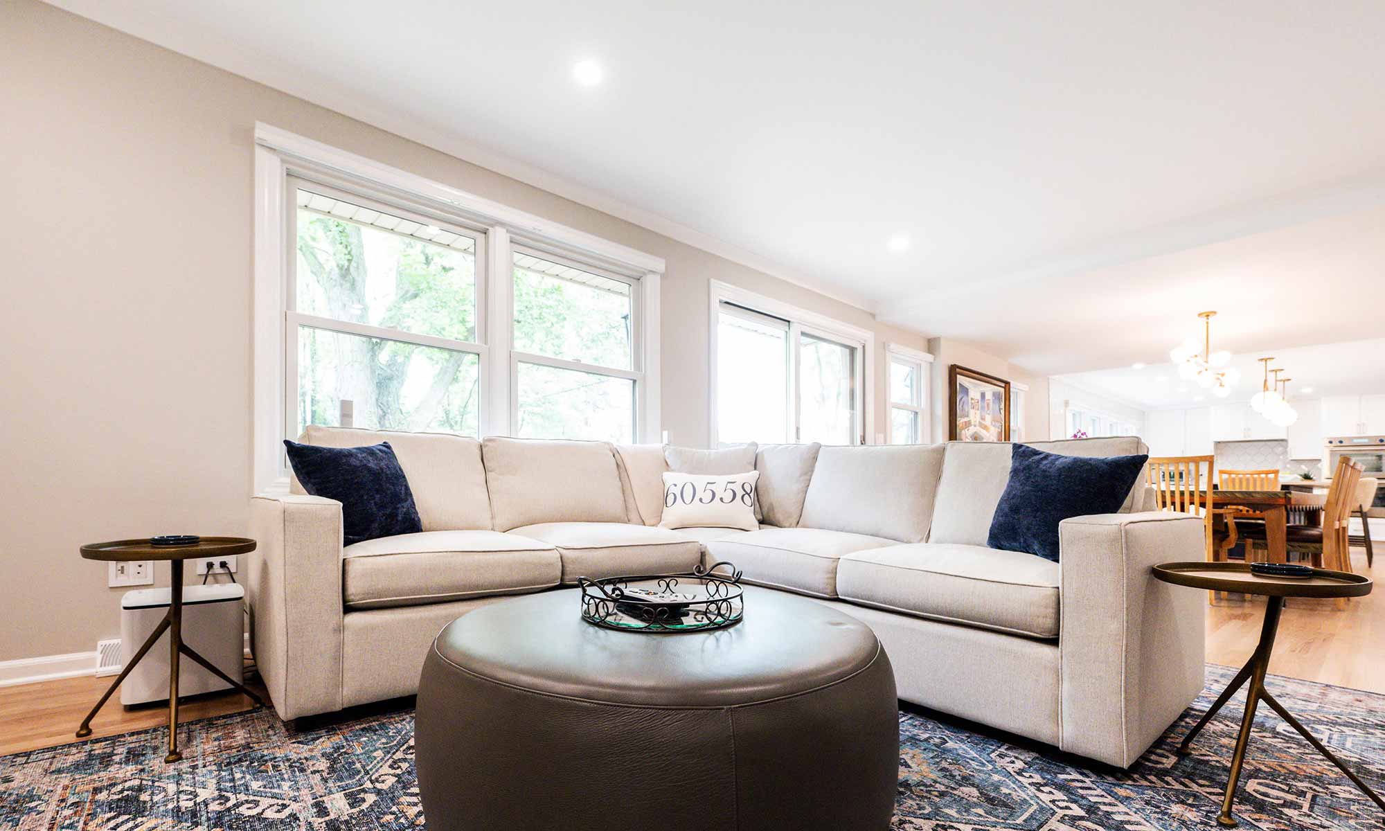 A living room with a couch and a round coffee table