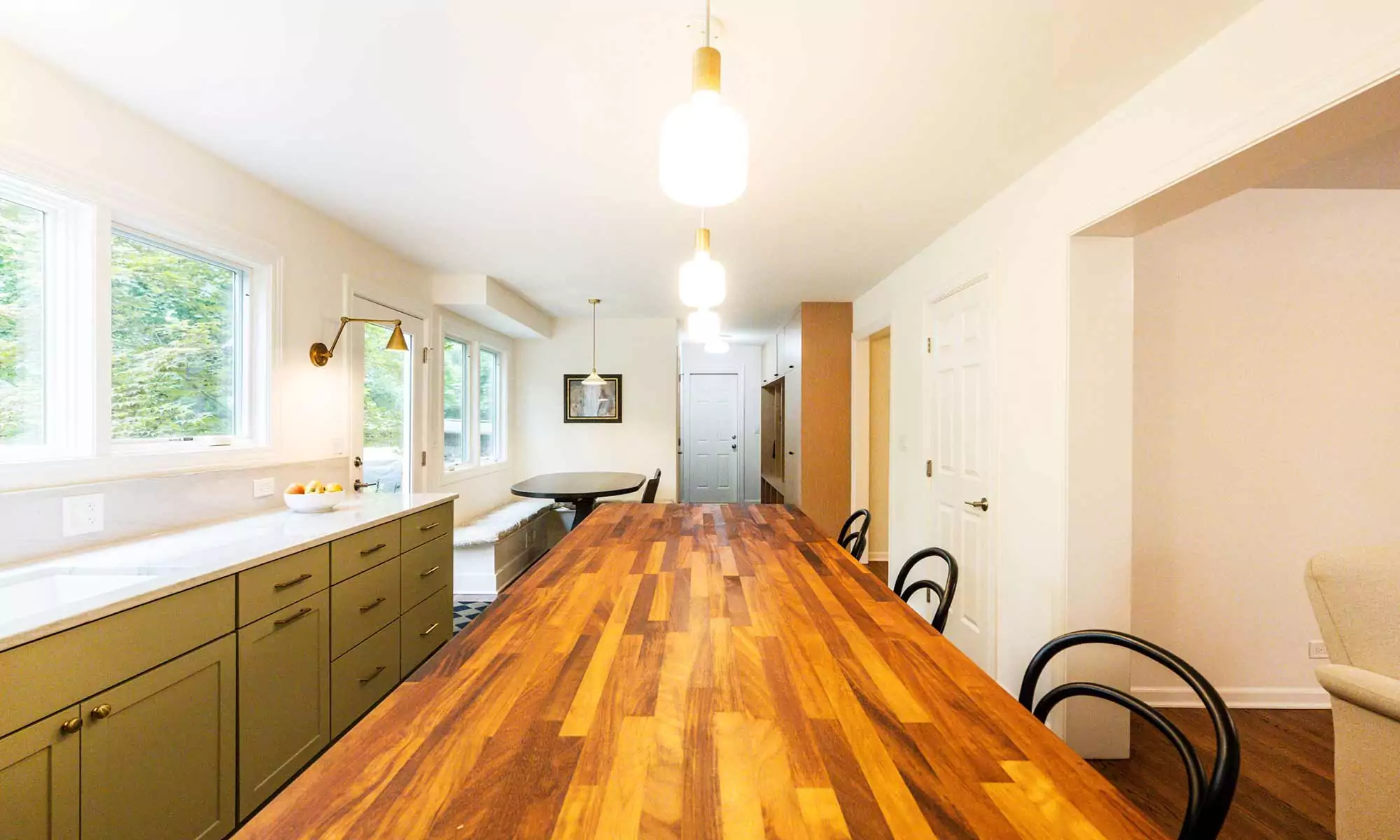 luxury kitchen remodel with green cabinets and butcherblock island