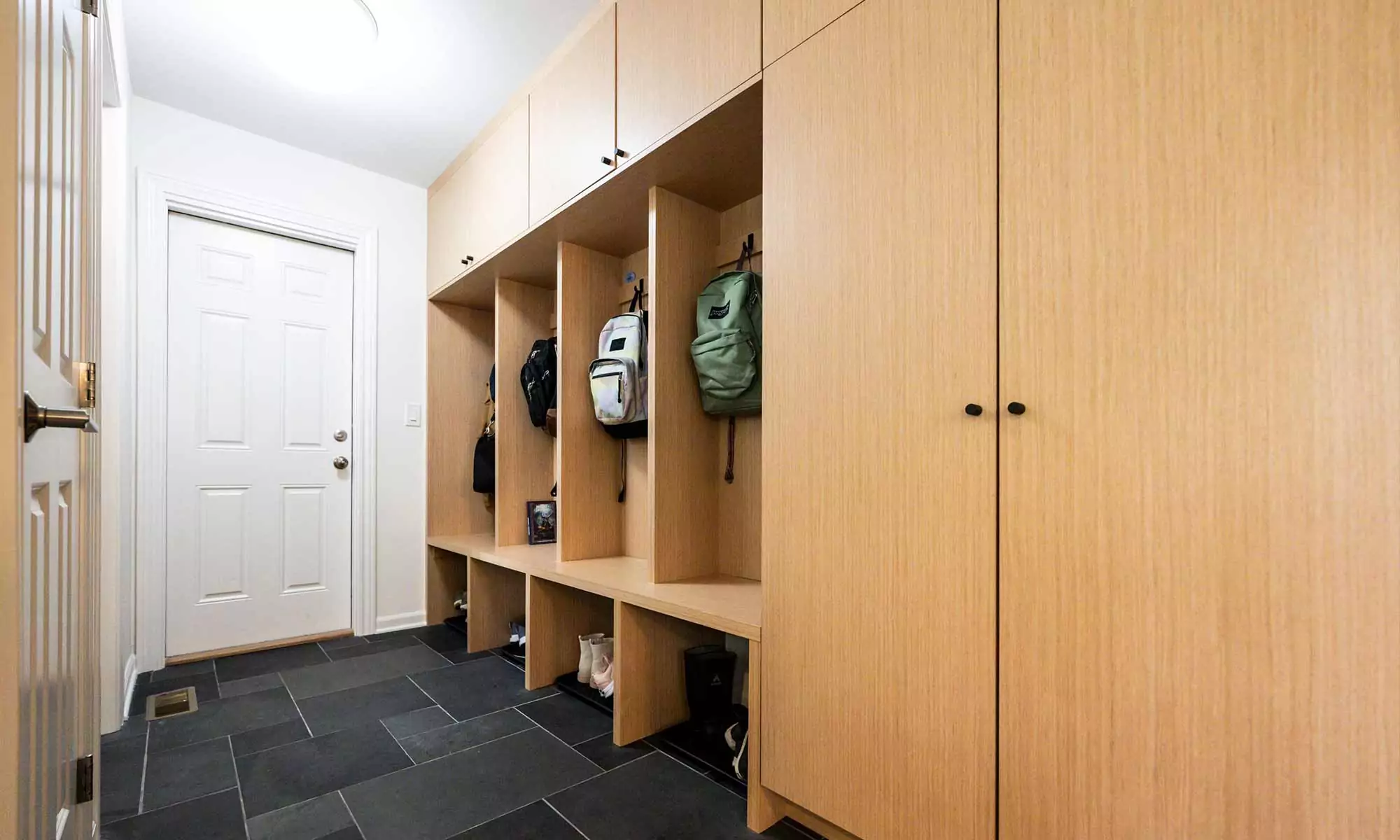 white oak mudroom built-ins in luxury home remodel