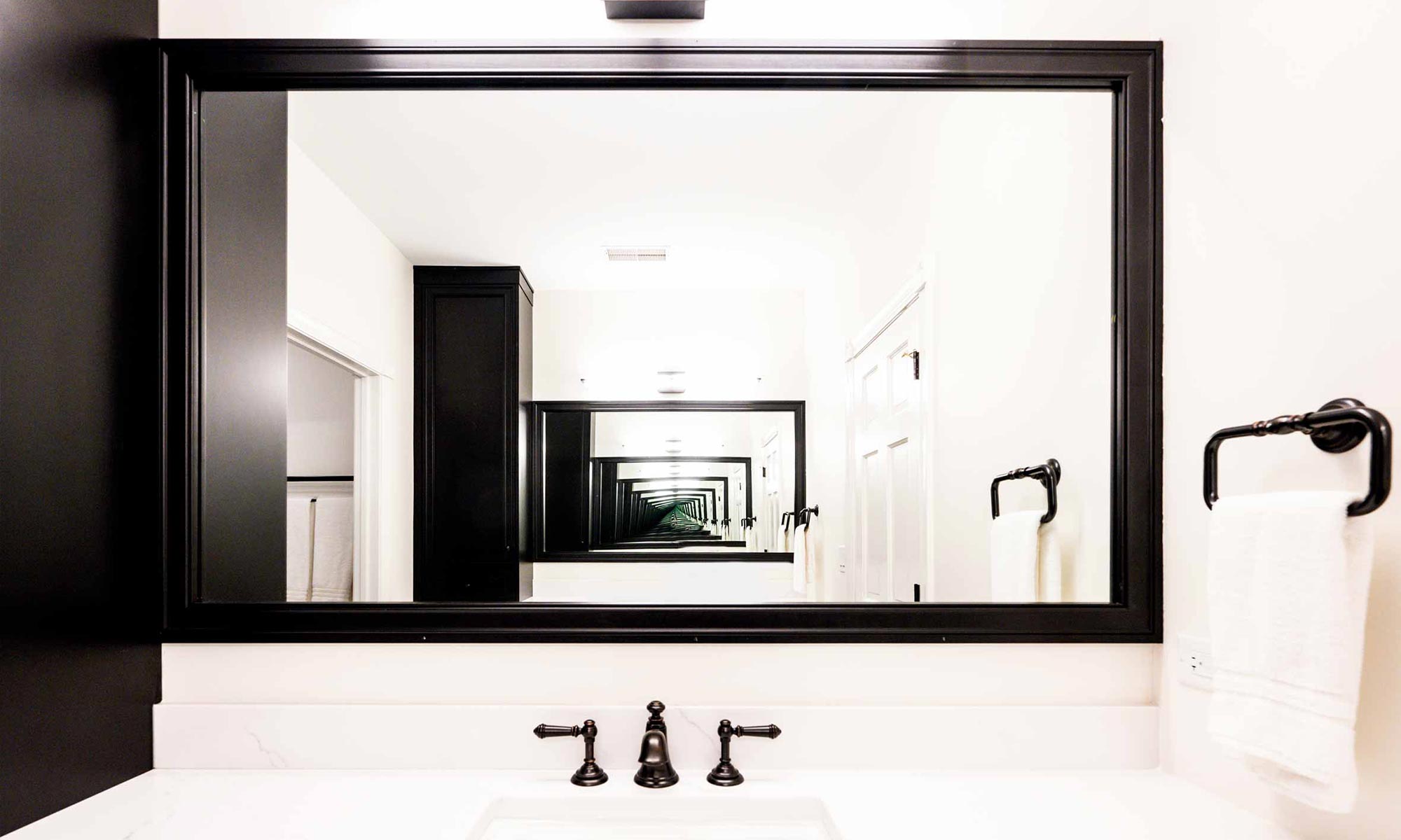 black framed mirror in luxury kitchen remodel