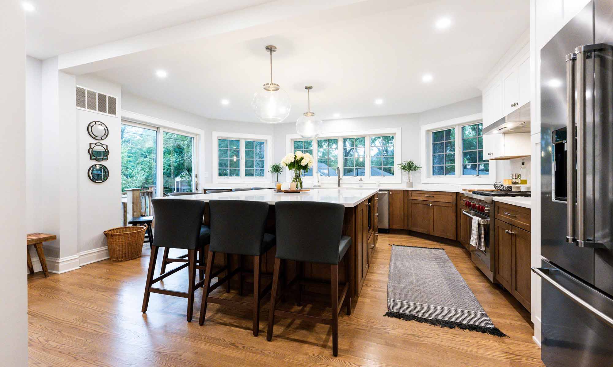 large kitchen island in luxury remodel with eight windows