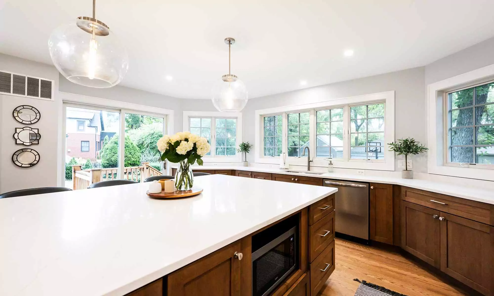large kitchen island in luxury remodel with eight windows