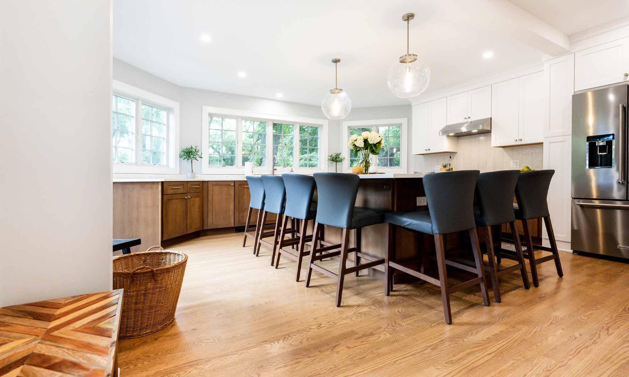 large kitchen island in luxury remodel with eight windows