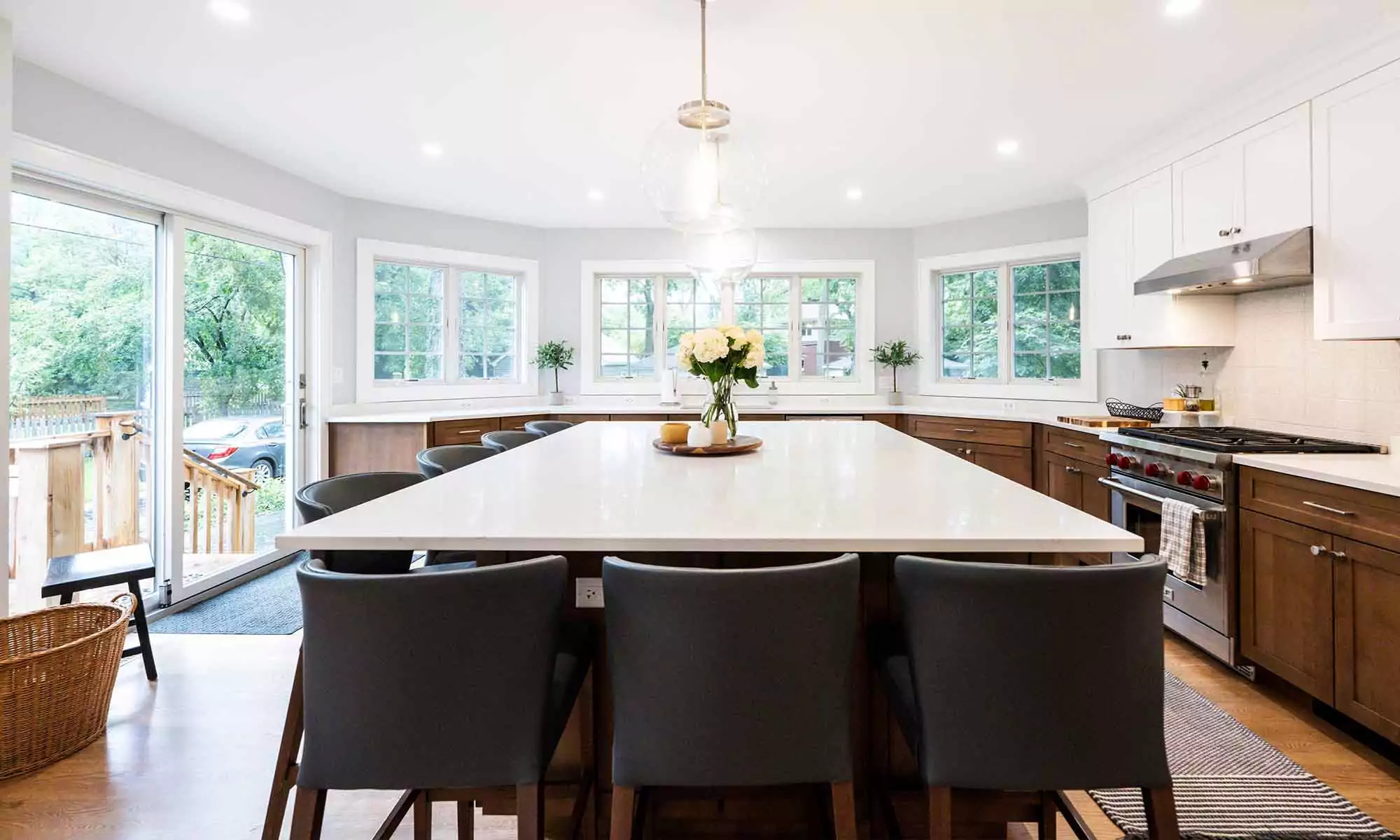 large kitchen island in luxury remodel with eight windows