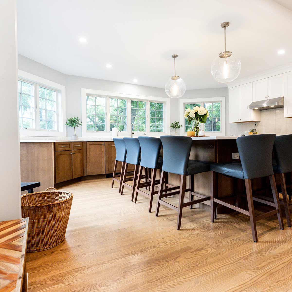 kitchen addition with large island and windows over perimiter cabinets