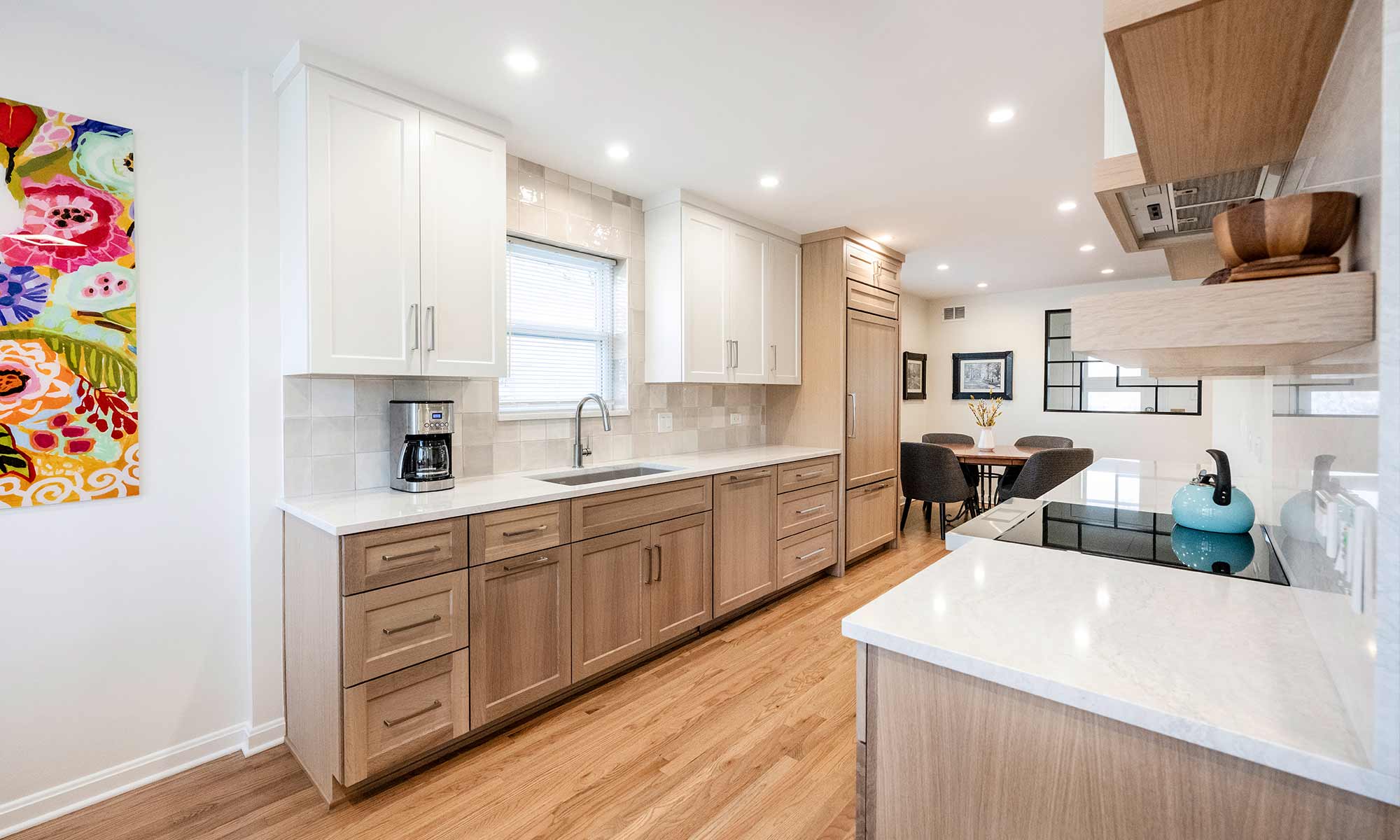 galley kitchen luxury remodel with white oak cabinets and window over sink