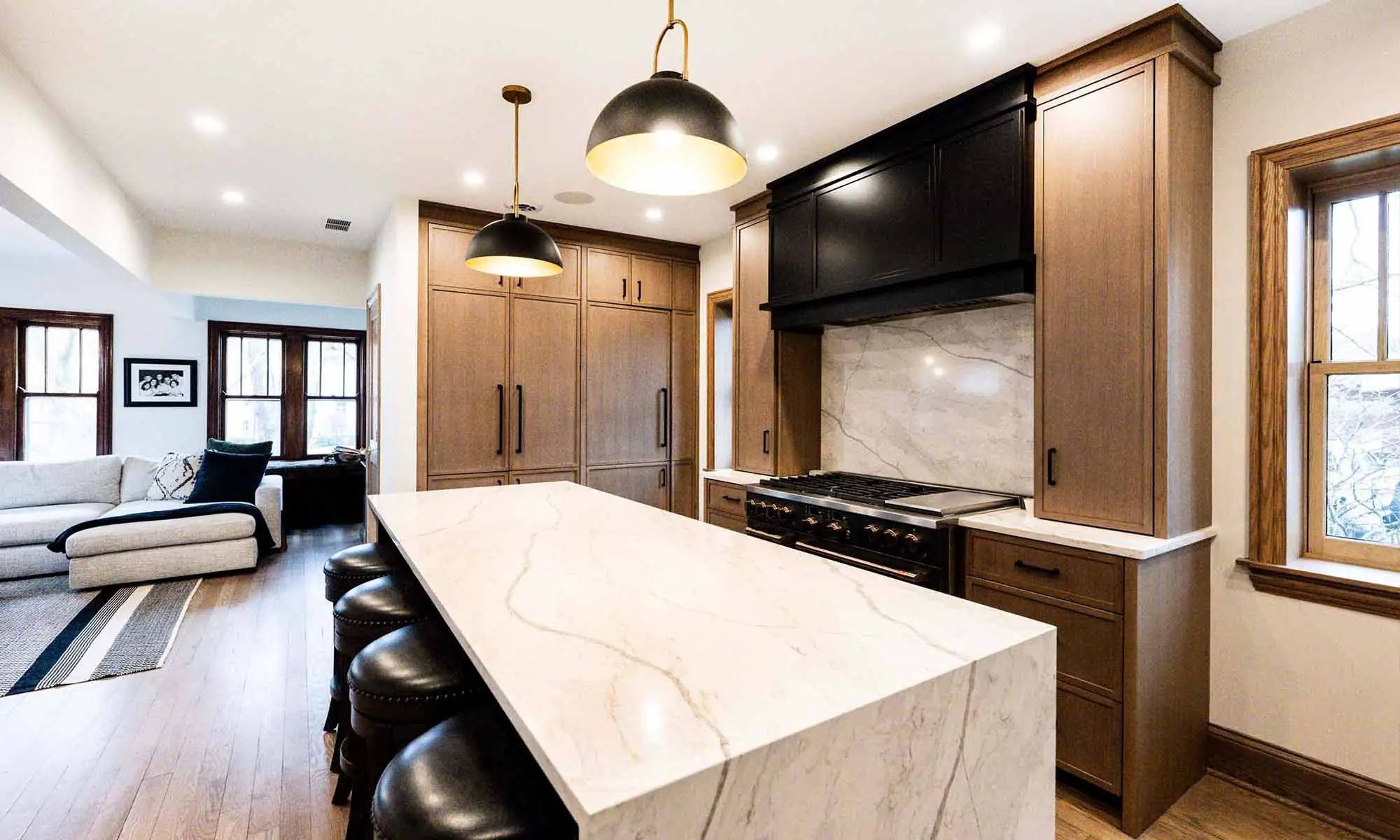 modern luxury kitchen remodel with white oak cabinets and dark grey appliances