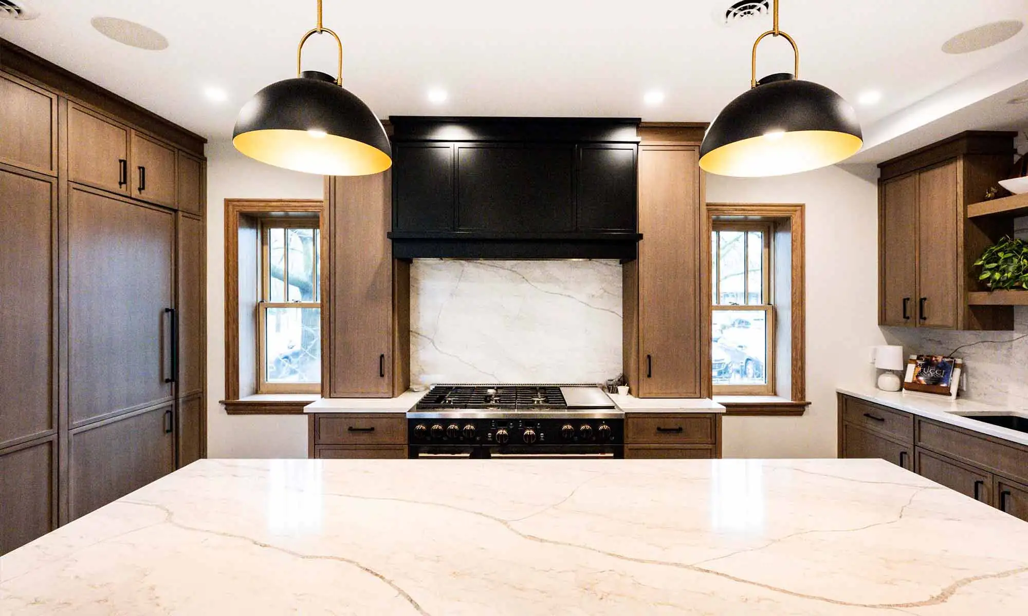 large range wall with oak cabinetry in luxury kitchen remodel