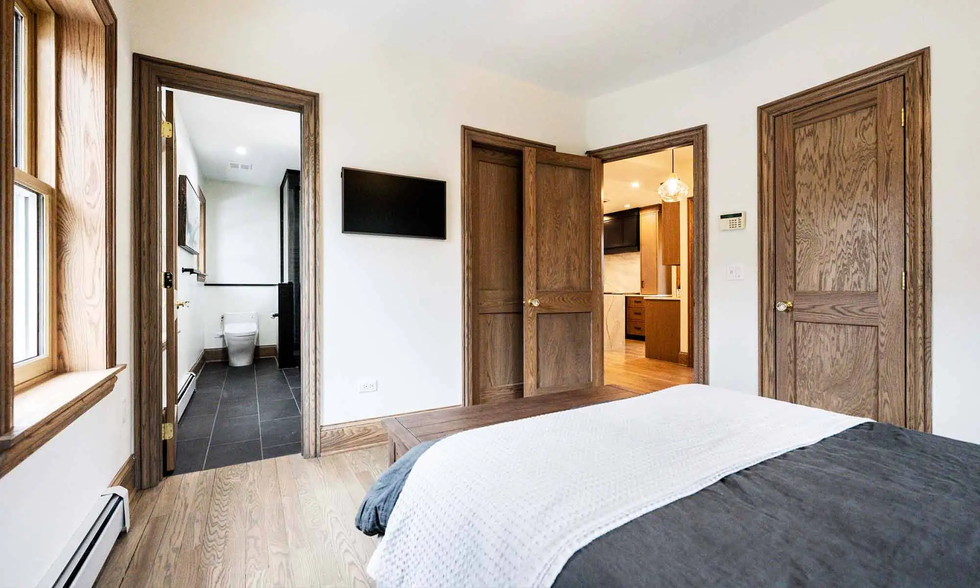 primary bedroom remodel with dark wood trim