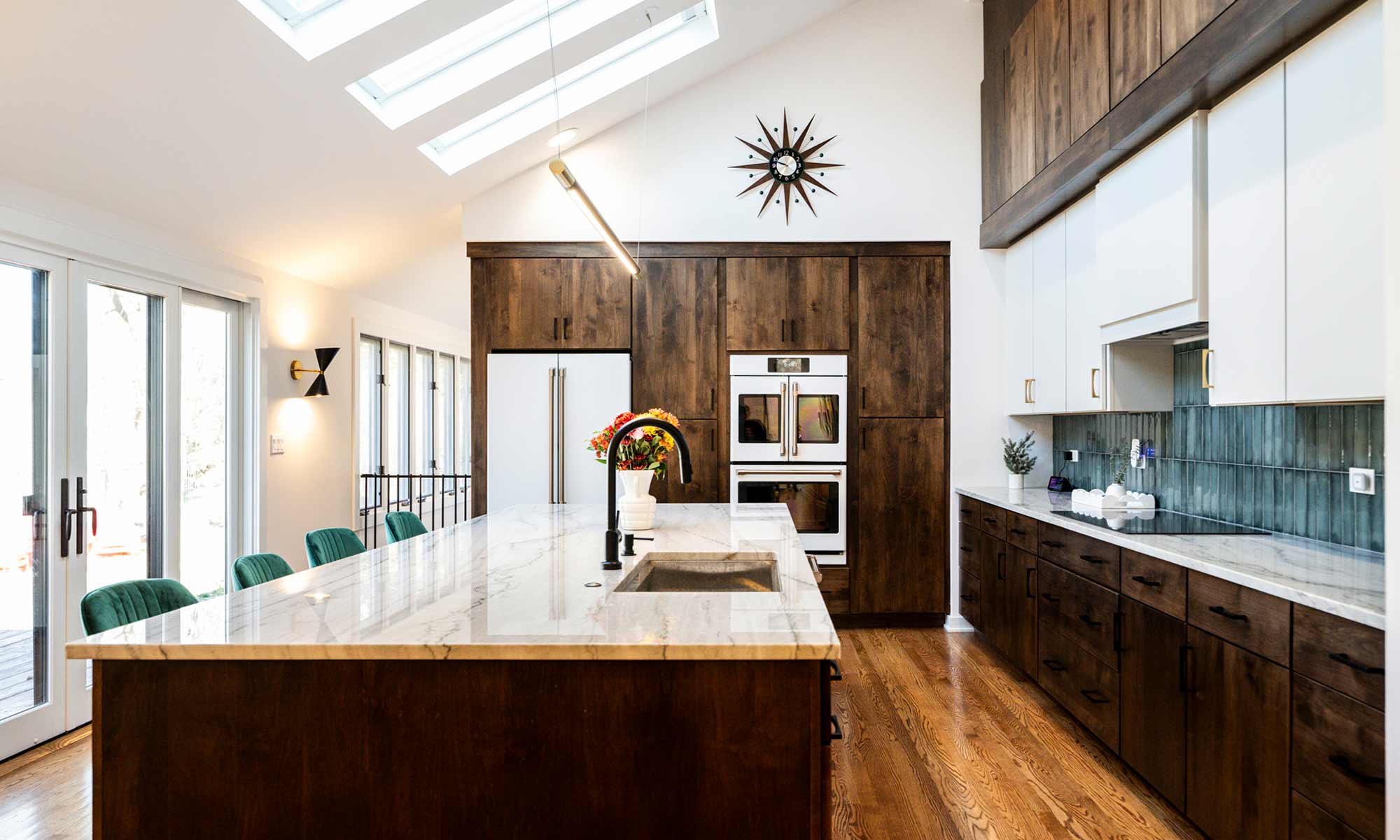 A modern kitchen featuring wooden cabinets and a spacious center island, creating an inviting cooking space.